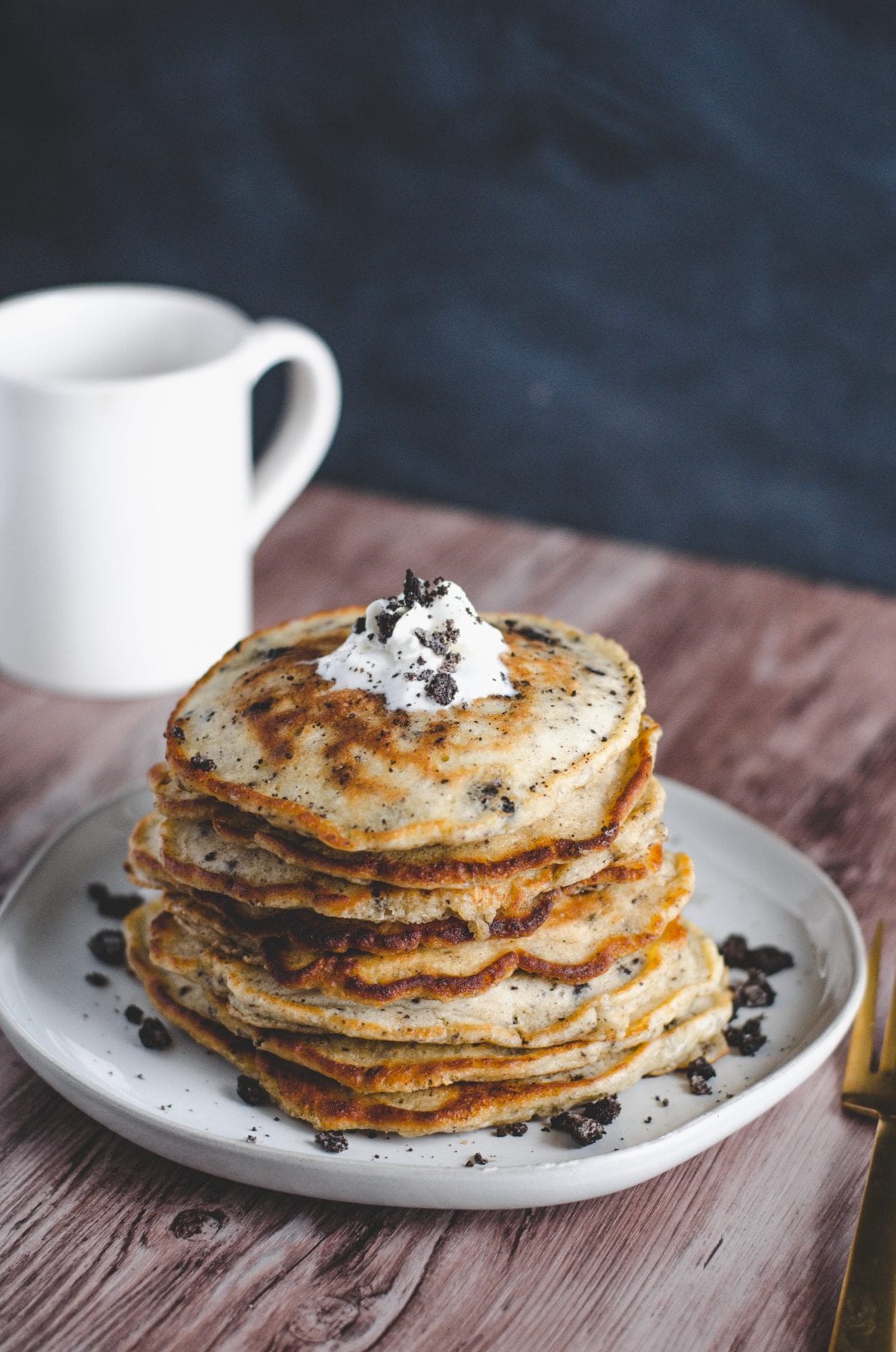 cookies and cream pancakes stacked on plate