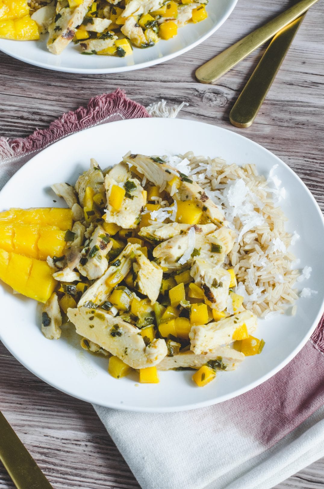 mango chicken with coconut rice on a plate