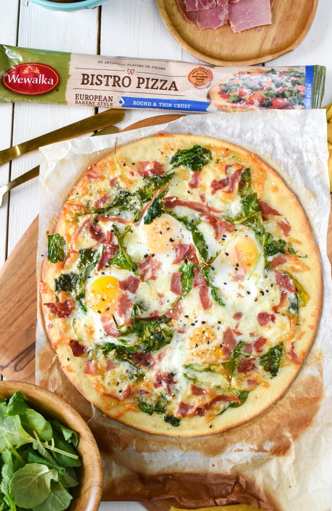 pizza with country ham, eggs, spinach and seasoning