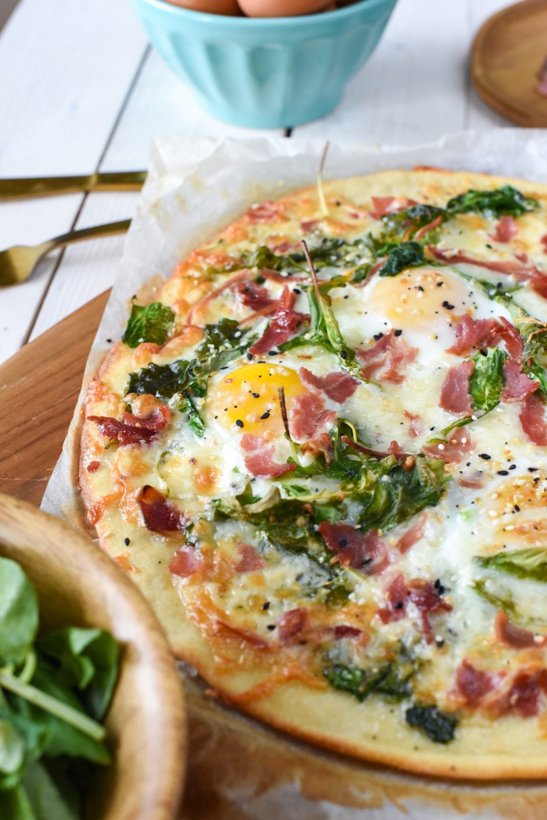 pizza with country ham, eggs, spinach and seasoning
